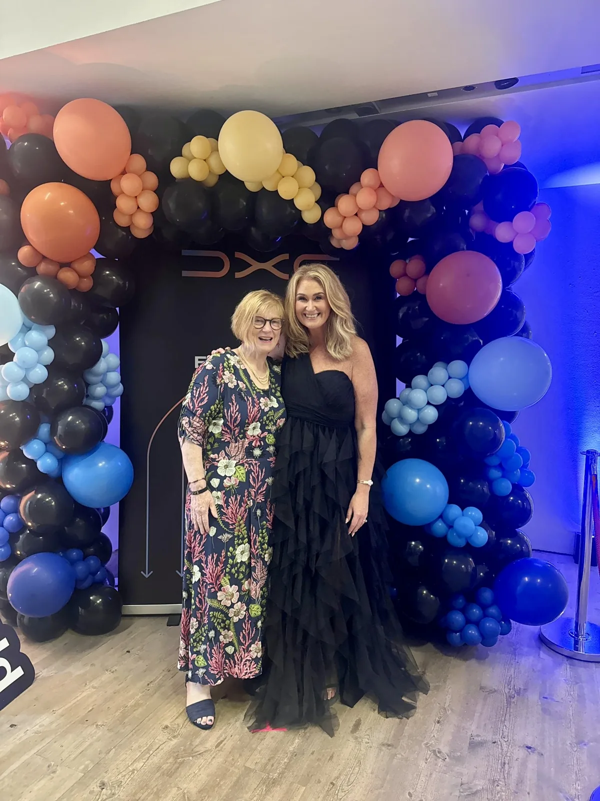 Carol with another guest at a DXC event
